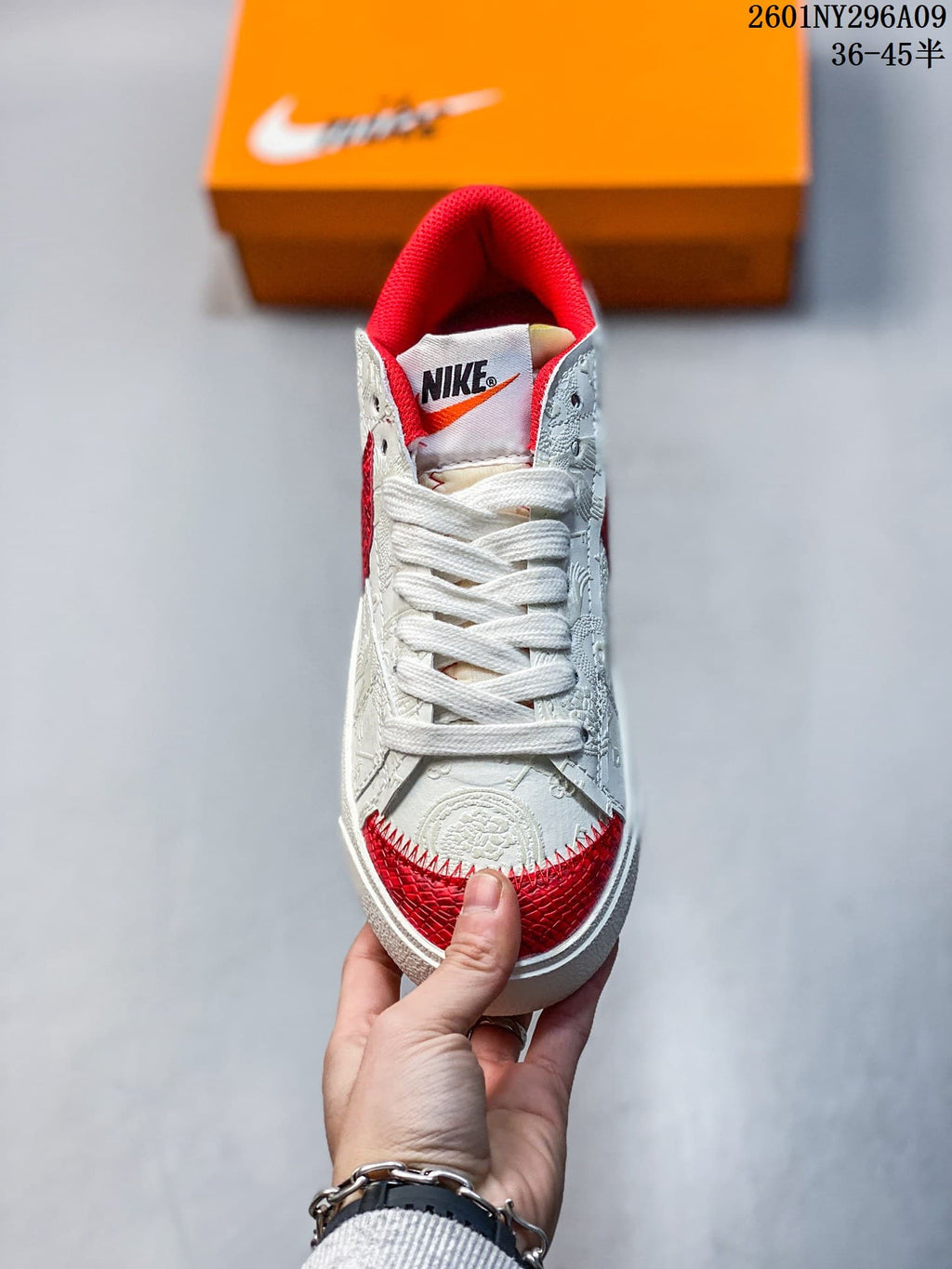Front view showing wide white laces and red toe accents