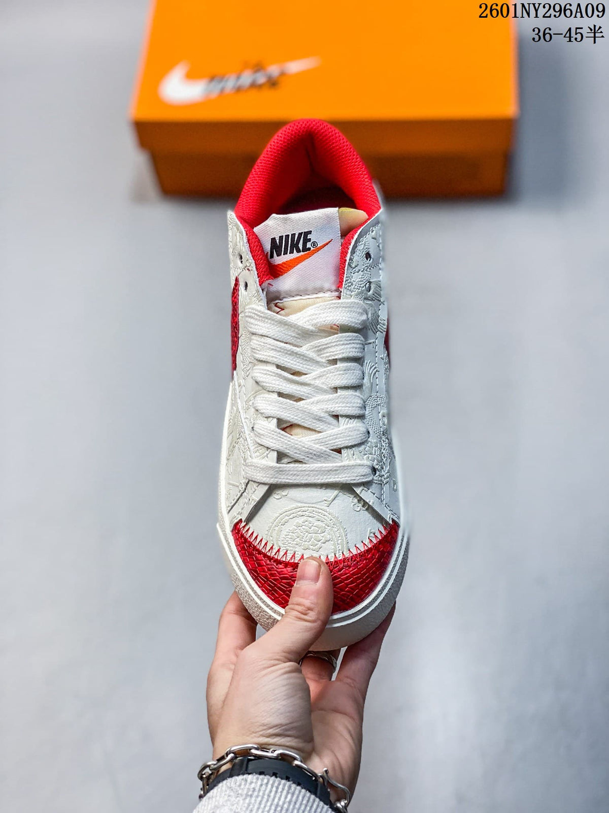 Front view showing wide white laces and red toe accents