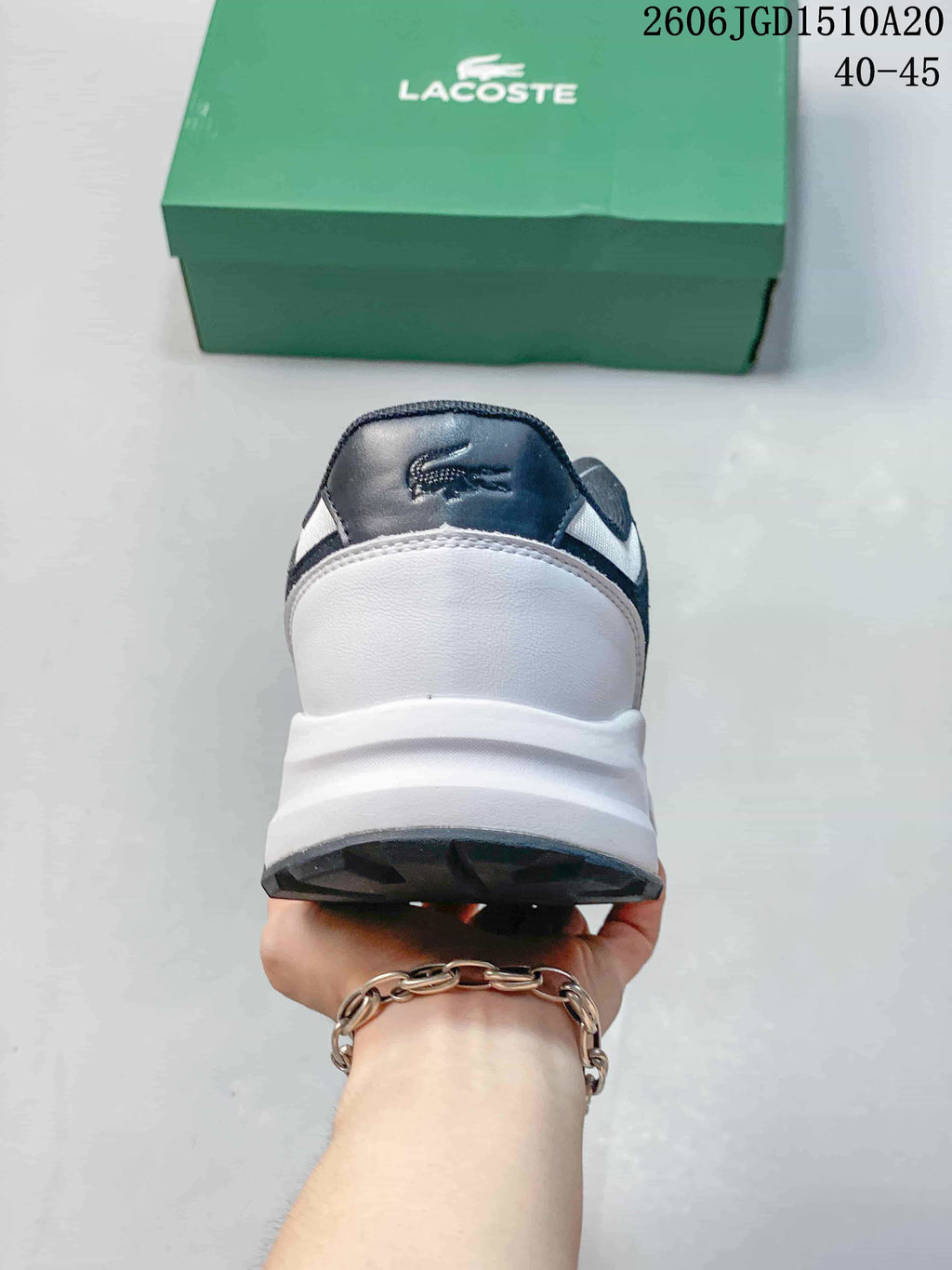 Rear view of the sneaker showing the white heel and navy heel tab