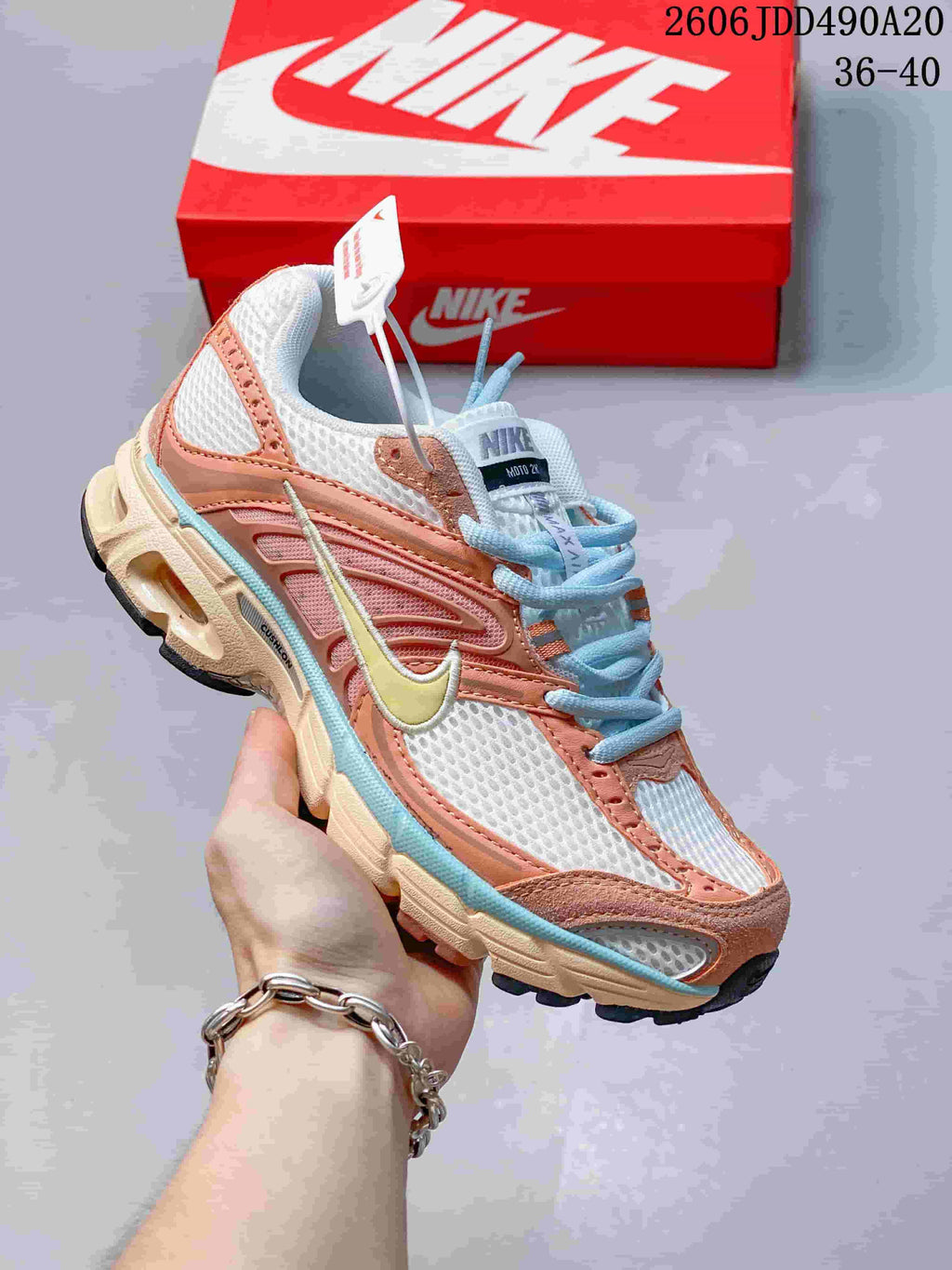 Coral, white and pale blue Nike Air Max Moto 2K sneaker