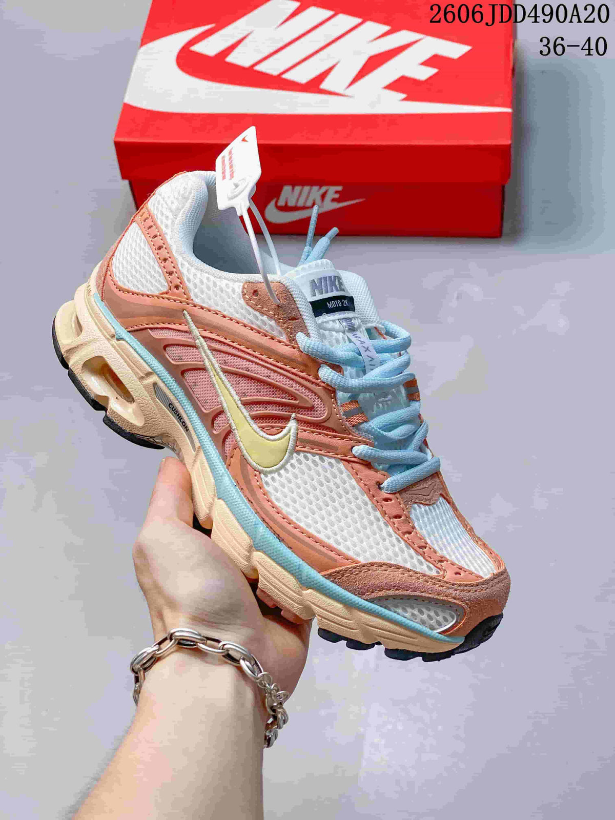 Coral, white and pale blue Nike Air Max Moto 2K sneaker