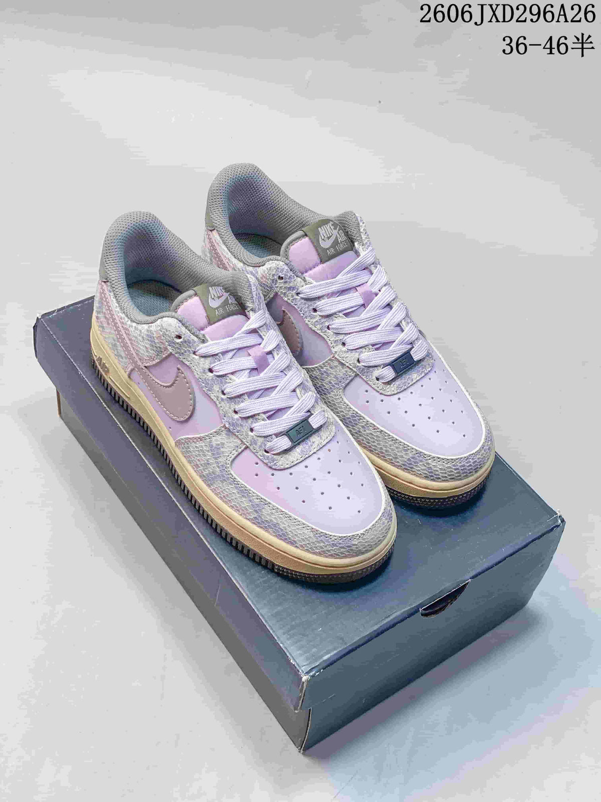 Lavender Nike Air Force 1 low-top sneakers with patterned overlays and muted Swooshes