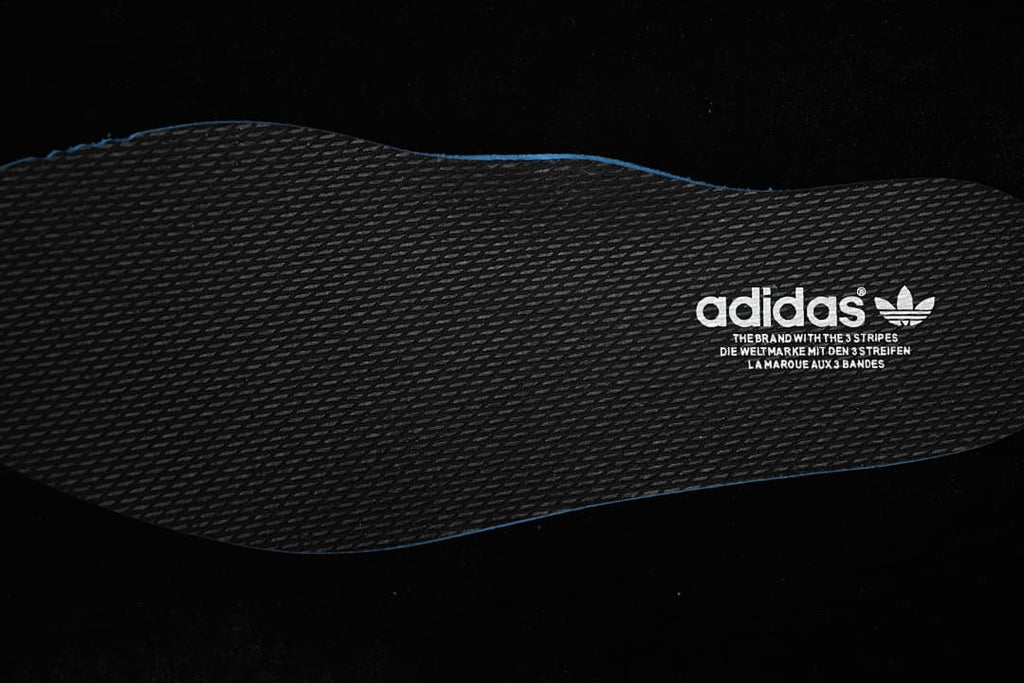 Close-up of the dark textured insole with adidas branding