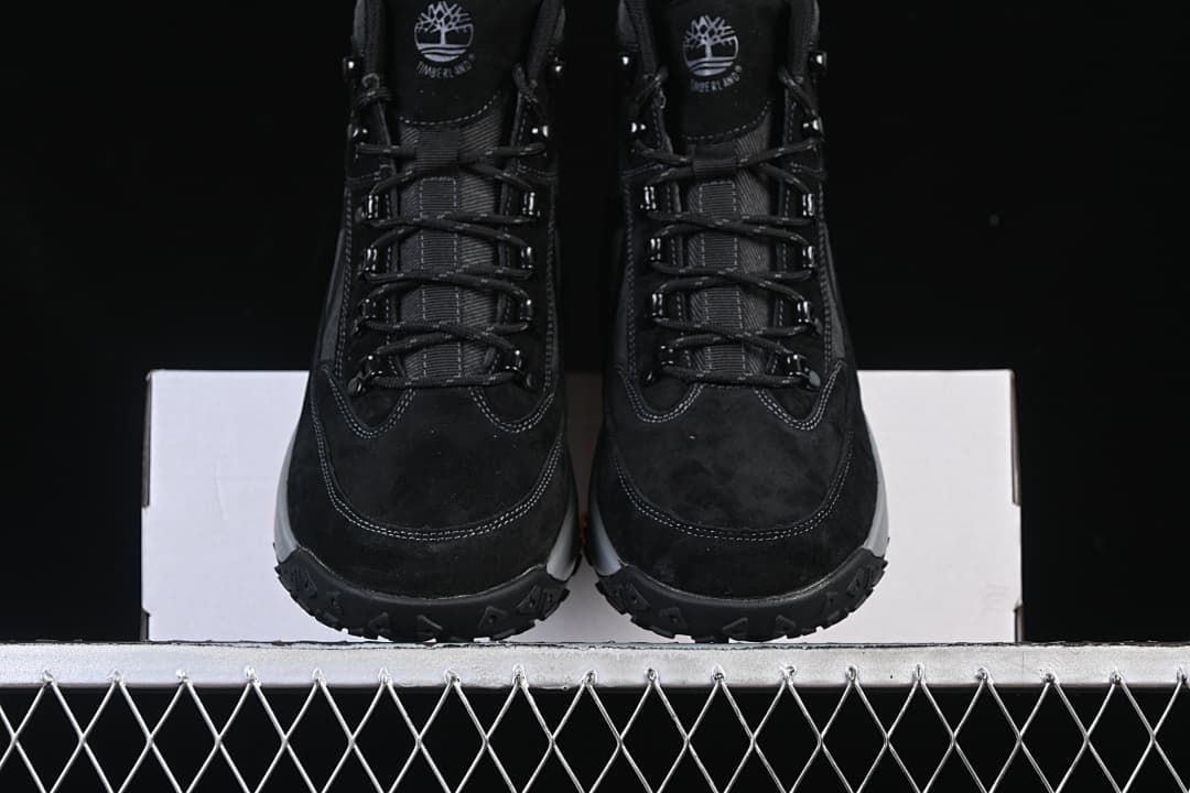 Front view of the pair showing the toe shape, laces, and tread.