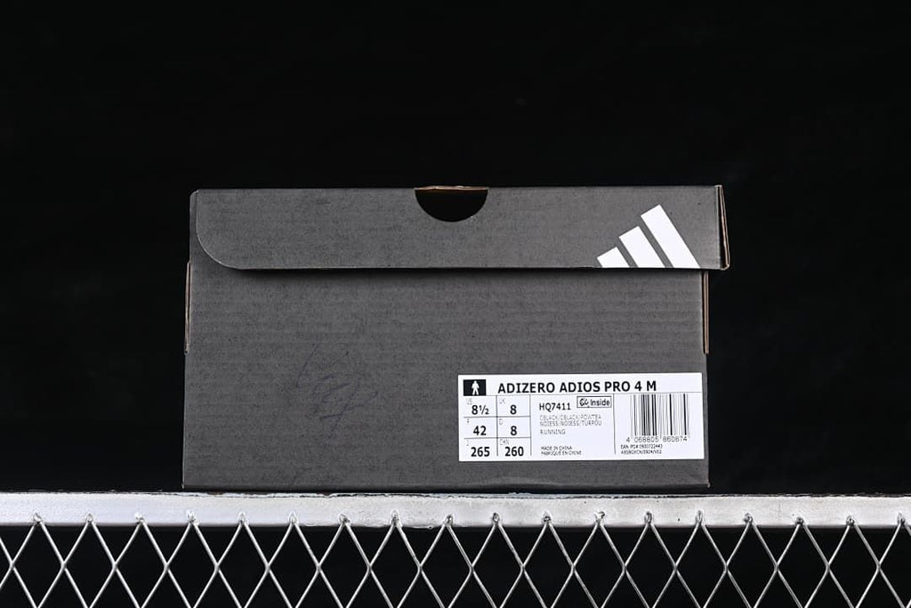 Shoe box label identifying Adizero Adios Pro 4 M, style HQ7411, and EU size 42