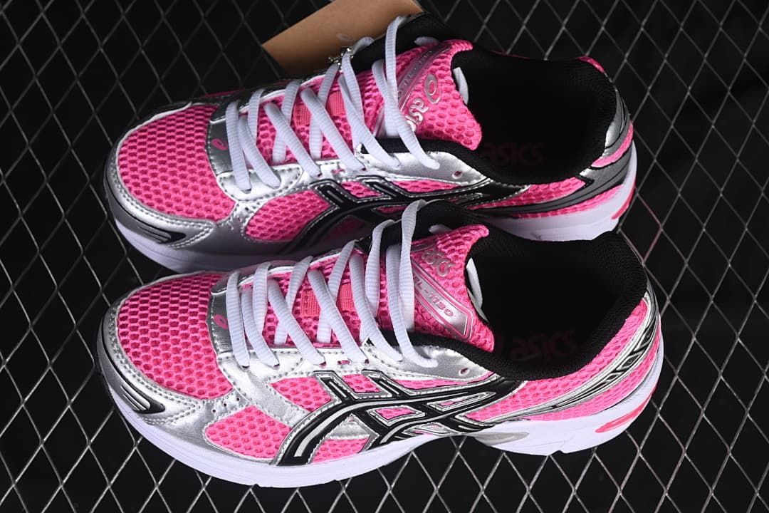 Pair of pink, silver, and black sneakers viewed from above.