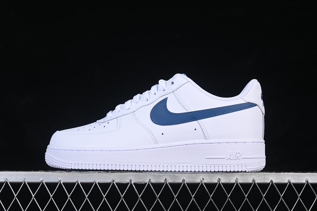 Side profile of the white and navy Nike Air Force 1 ’07 Low sneaker
