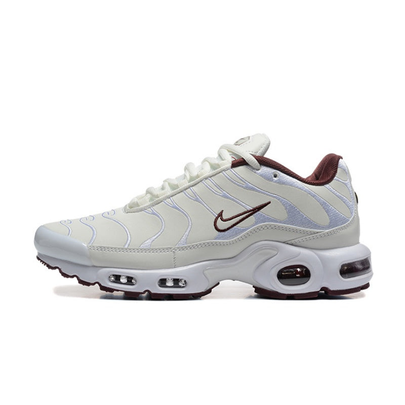 White and pale silver Nike Air Max Plus sneaker with burgundy details.