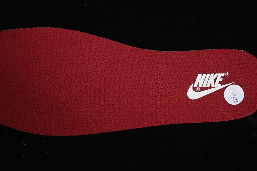 Burgundy insole with a Nike logo and size sticker