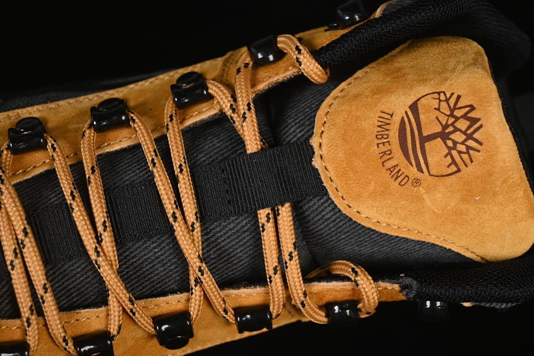 Close-up of the boot tongue, laces, and Timberland tree logo