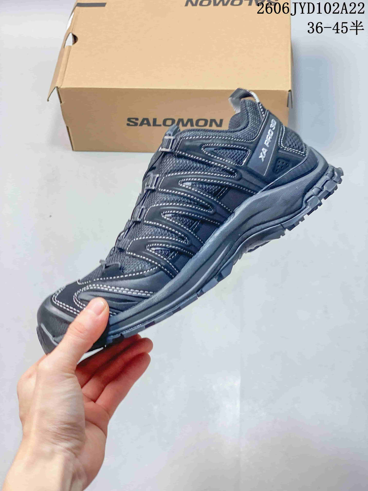 Side view showing the dark gray shoe's mesh upper, overlays, and XA Pro 3D marking.