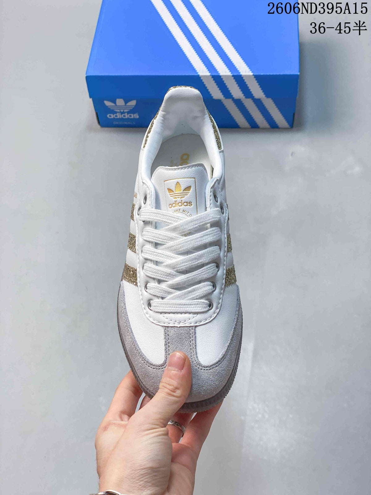 Top view showing white laces, grey toe detailing and gold-toned tongue branding