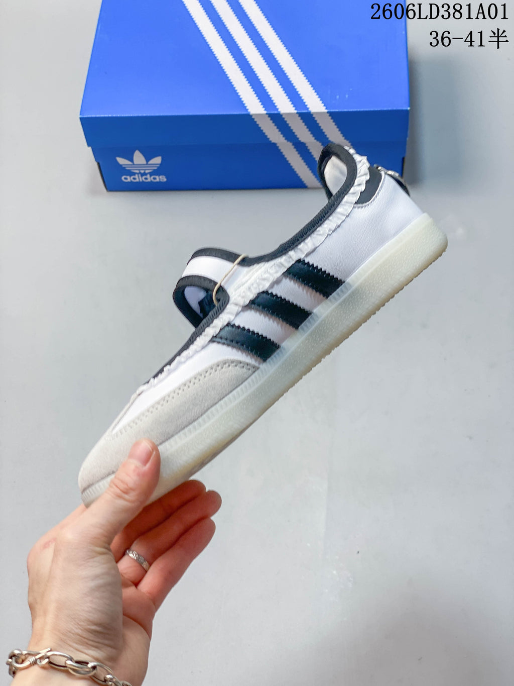 Side view of the Adidas Samba Jane sneaker with three stripes and an instep strap