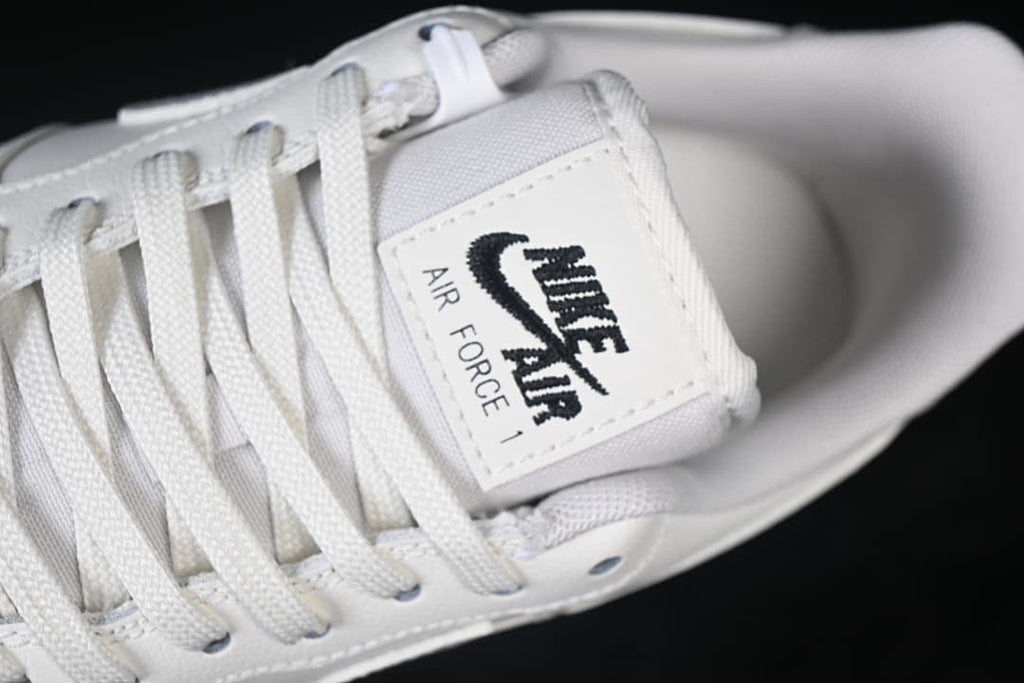 Close-up of the tongue label and white laces