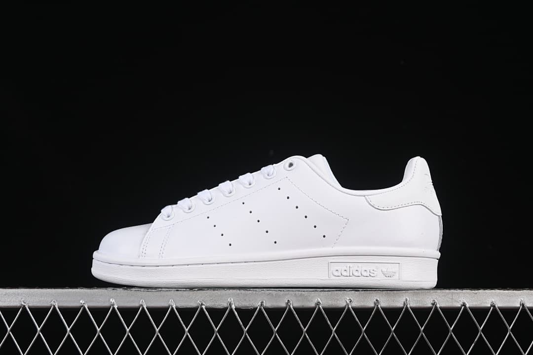 Side view of a white adidas Stan Smith low-top sneaker
