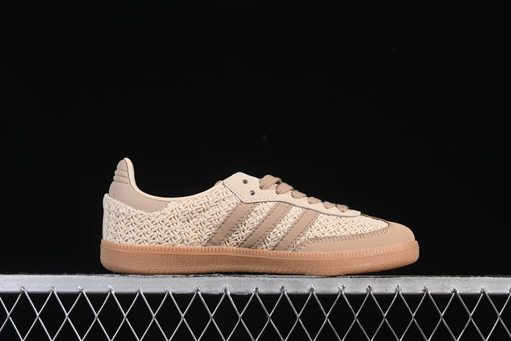 Side profile showing the cream woven upper, beige stripes and gum-colored sole