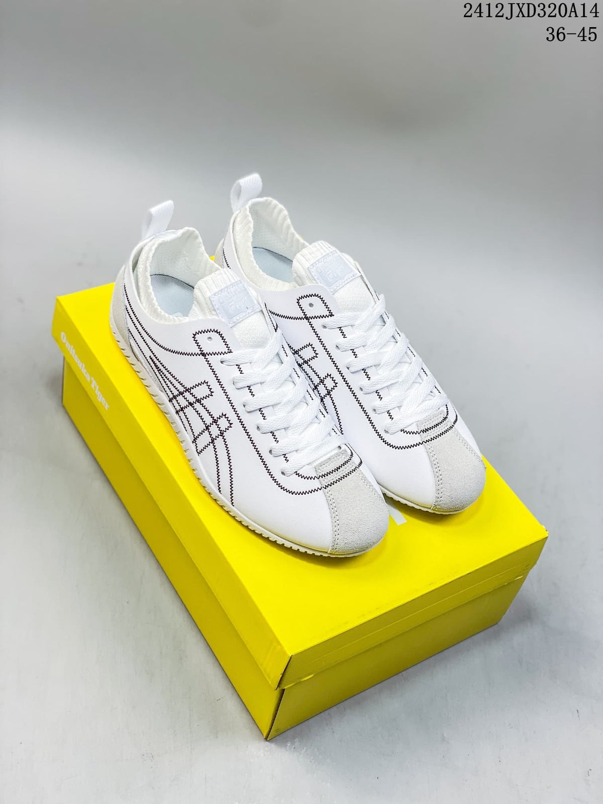 Pair of white Onitsuka Tiger SCLAW low-top sneakers with black stitched detailing, shown on a yellow shoebox
