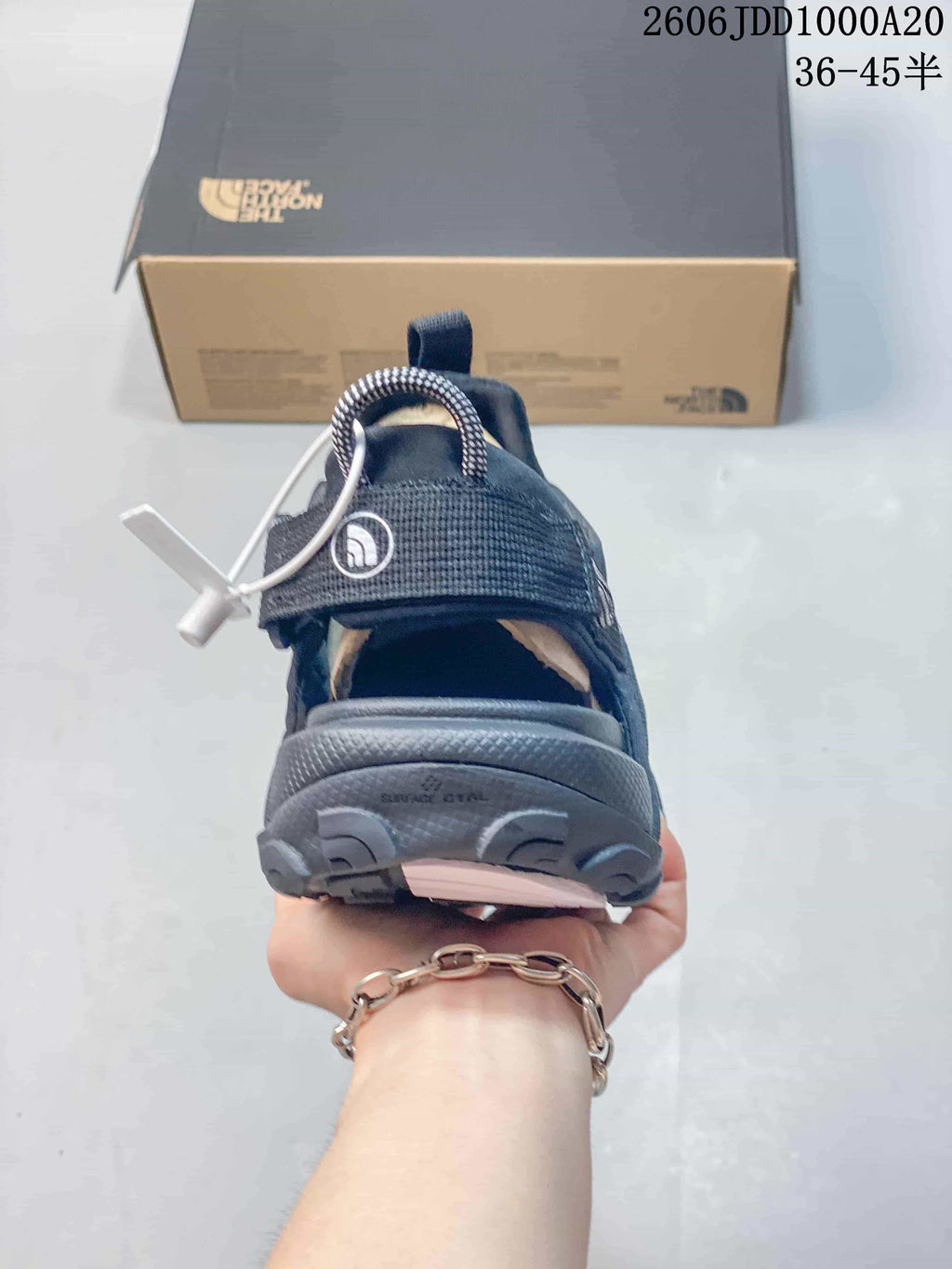 Rear view of a Cedar Measa sandal showing its heel opening and pull tab