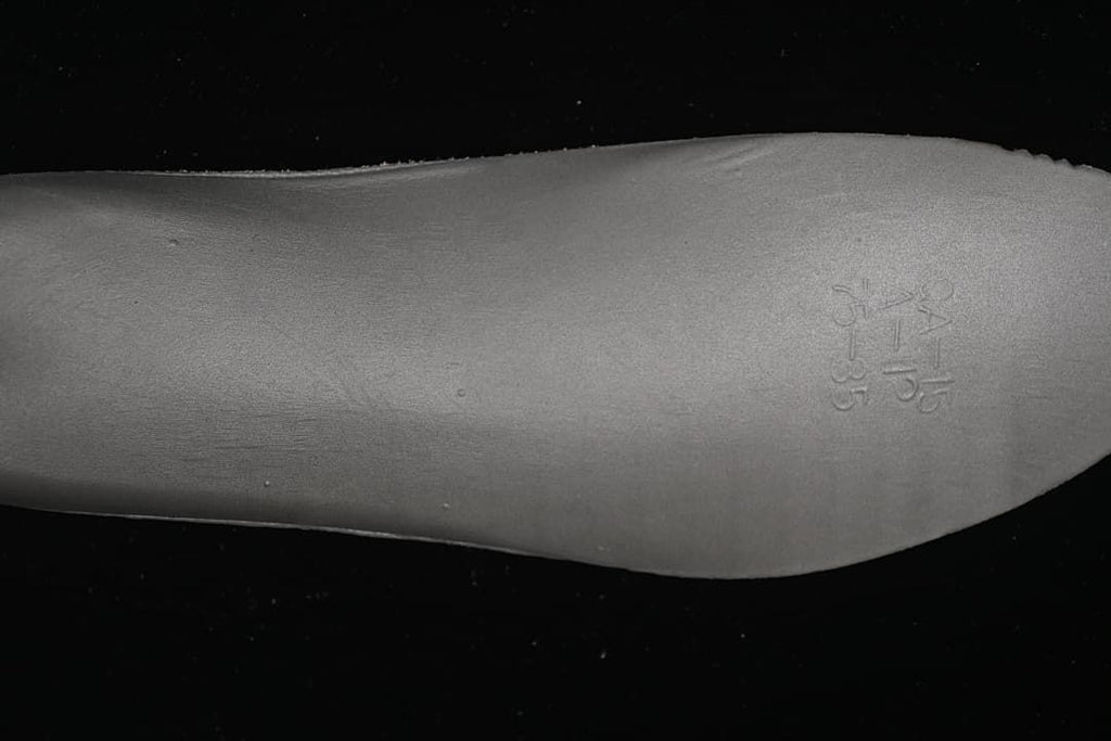 Close-up of an embossed size marking on the shoe footbed.
