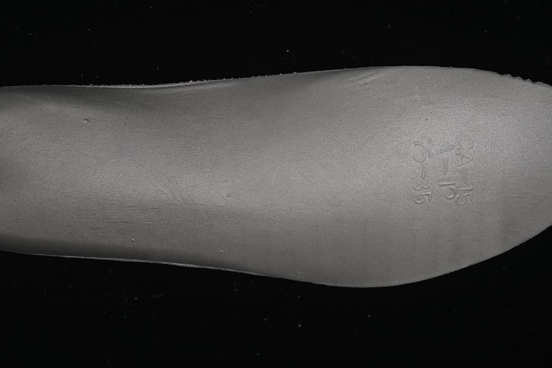 Close-up of an embossed size marking on the shoe footbed.