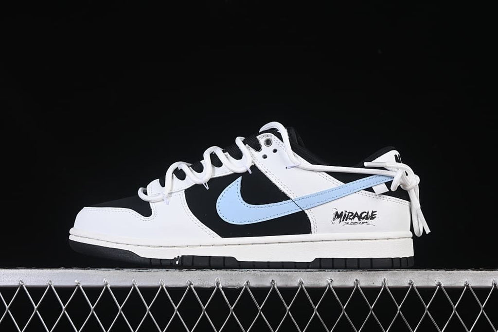 Side view of the sneaker showing white panels, black sections, blue Swoosh, and heel graphic