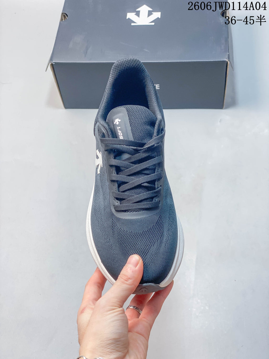 Top view of the sneaker showing its lace-up front and textured blue-gray upper.