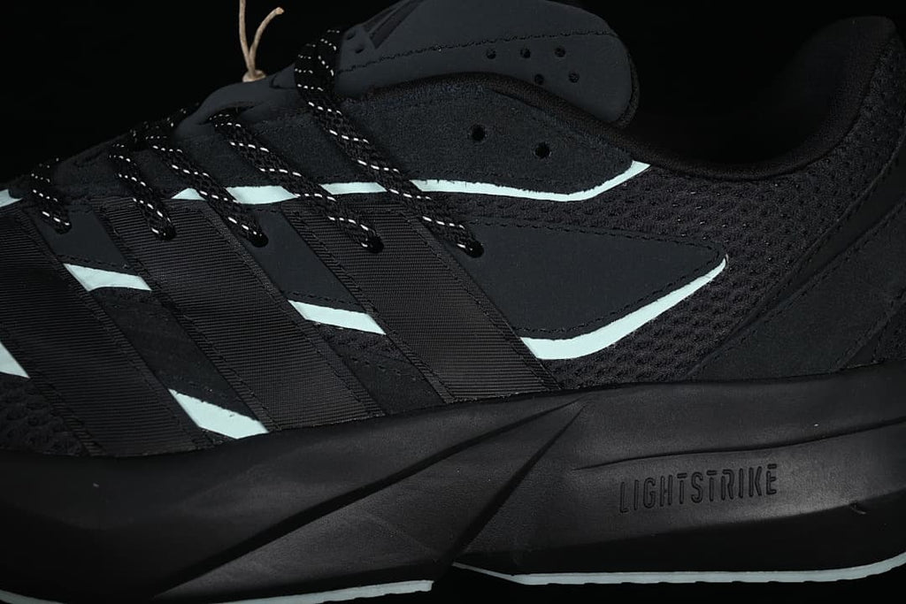 Close-up of mesh panels, lace loops, and sculpted midsole