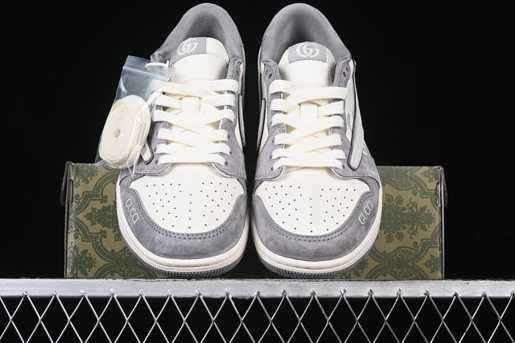 Front view of the pair with an extra set of laces beside the shoes
