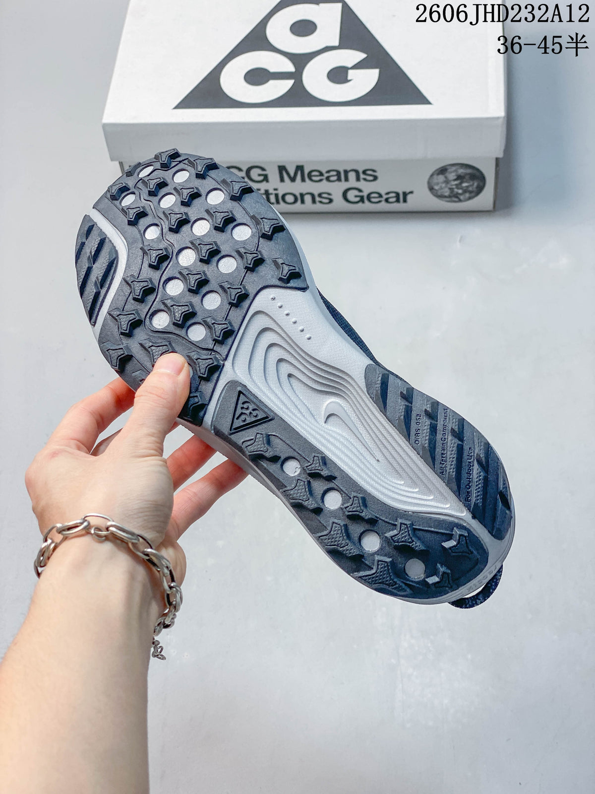 Underside of the Nike ACG Pegasus Trail shoe showing its raised tread pattern