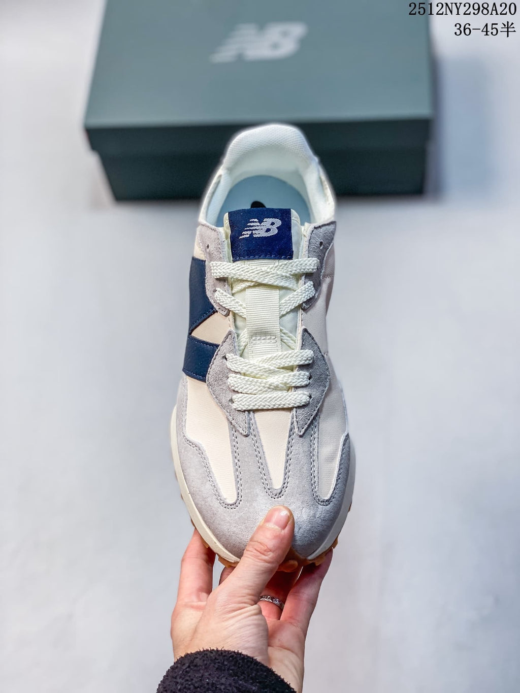 Front view of the sneaker showing its laces, tongue and layered toe panels.