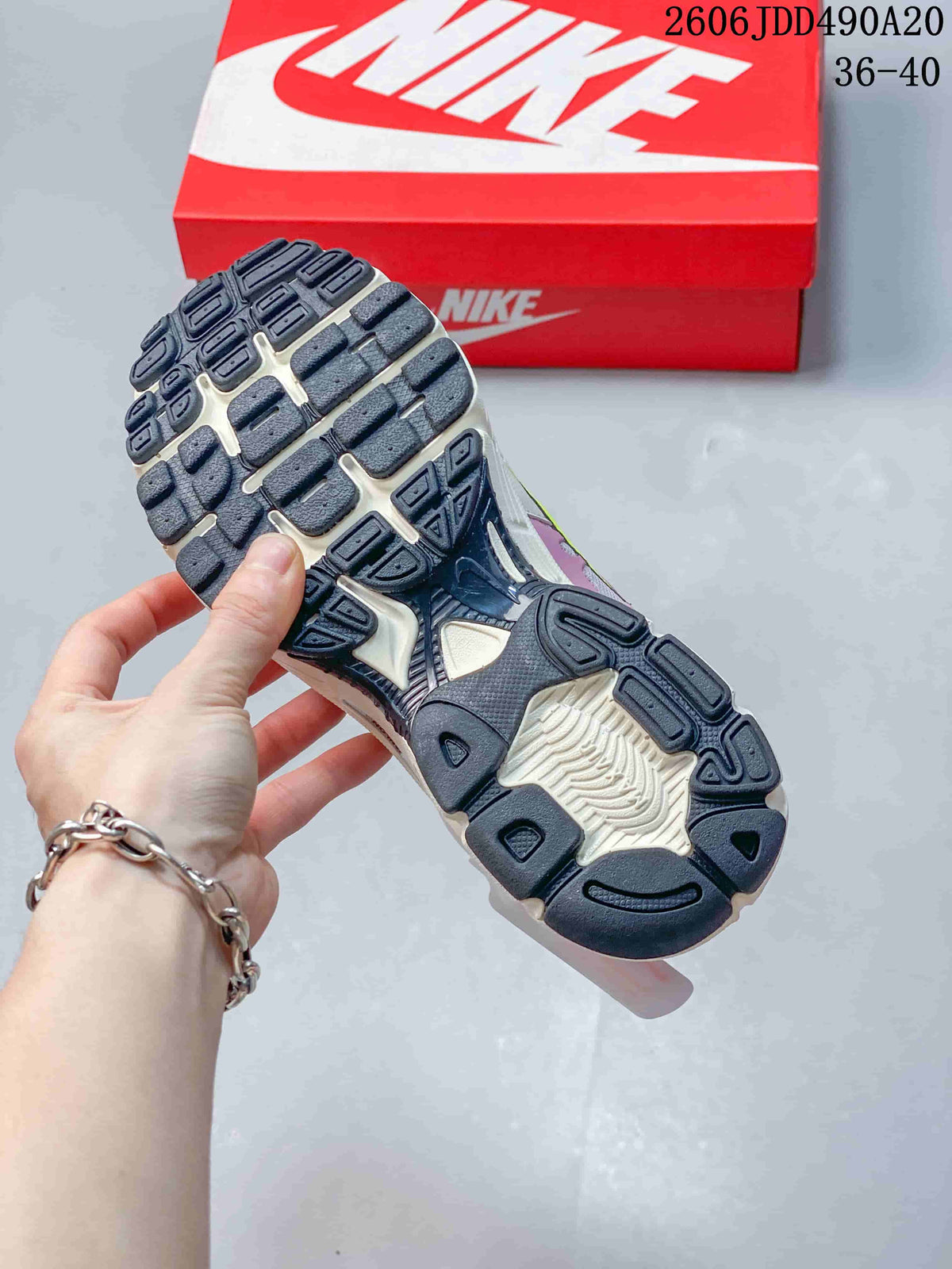 Close-up of the patterned outsole on a Nike Air Max Moto 2K sneaker