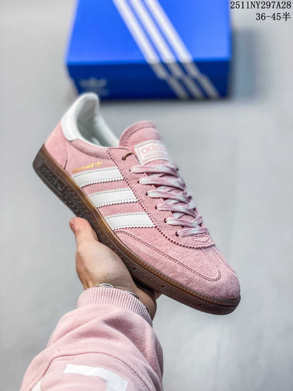 Pink adidas Handball Spezial sneaker with white stripes and a dark outsole
