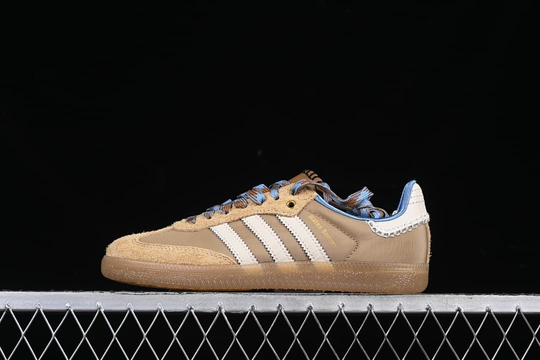 Side view of taupe and tan adidas Wales Bonner Samba sneakers with cream stripes, blue accents and gum-look outsole