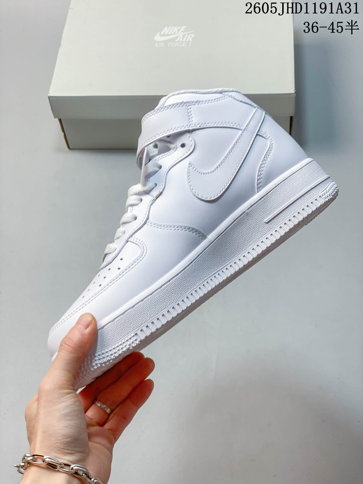 Side view of a white high-top sneaker with Swoosh panel and ankle strap