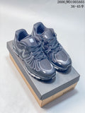 Pair of dark gray New Balance-style low-top sneakers shown from above on a shoe box.