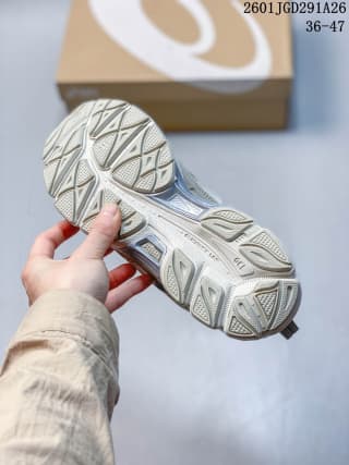 View of the ASICS GEL-NYC RGD outsole showing its segmented tread pattern and gray-and-white construction; image markings show 36–47 and 2601JGD291A26.