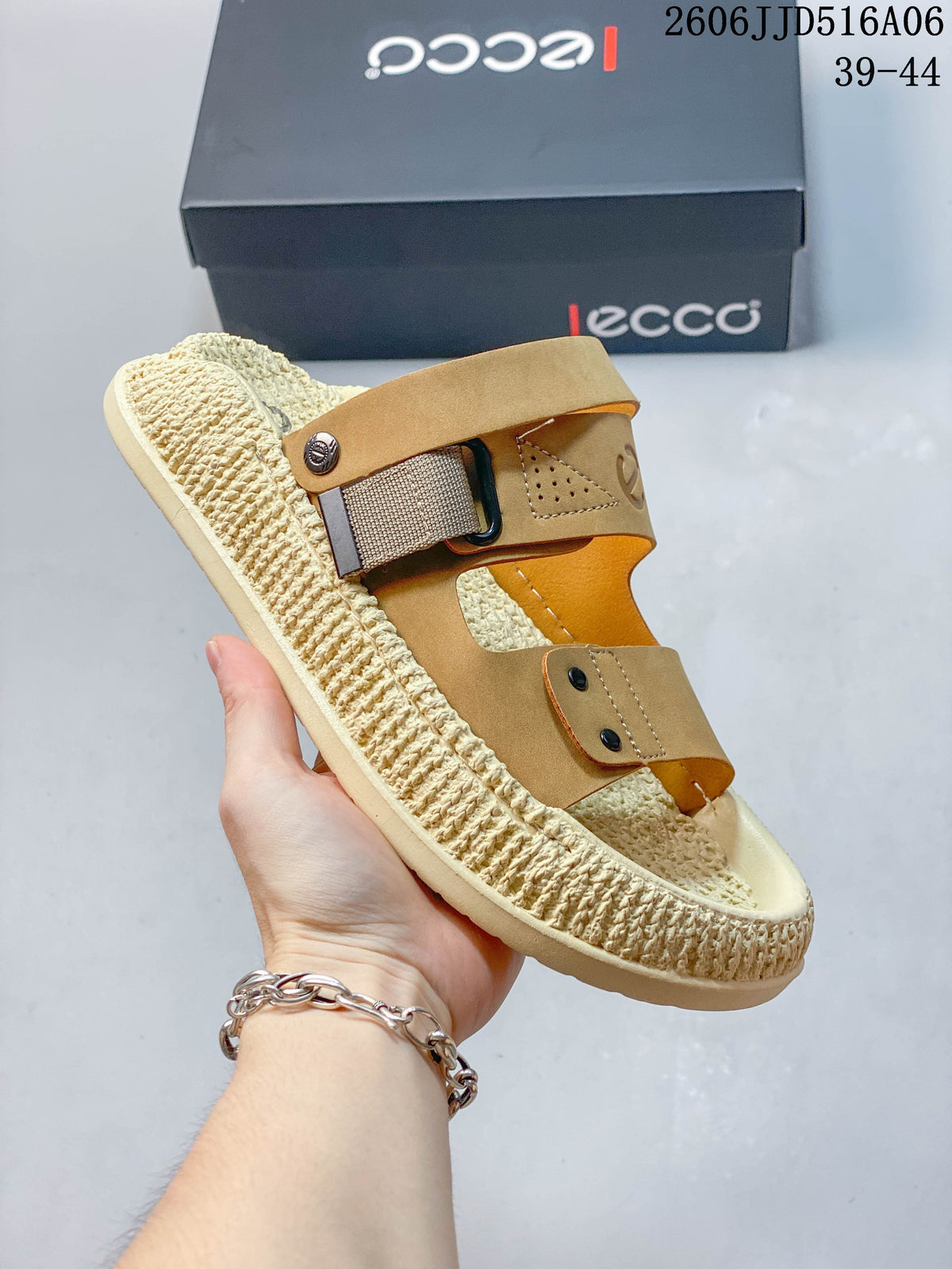 Angled view of a tan and cream sandal showing its adjustable strap hardware.