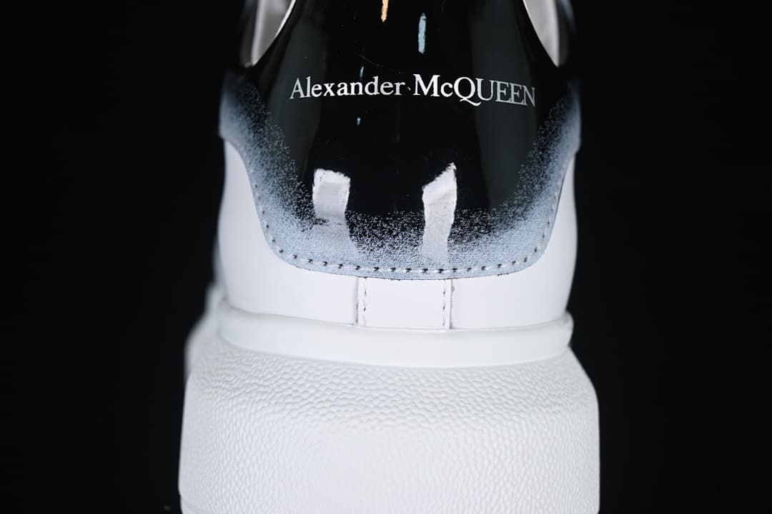 Rear view of the black gradient heel tab with Alexander McQueen text