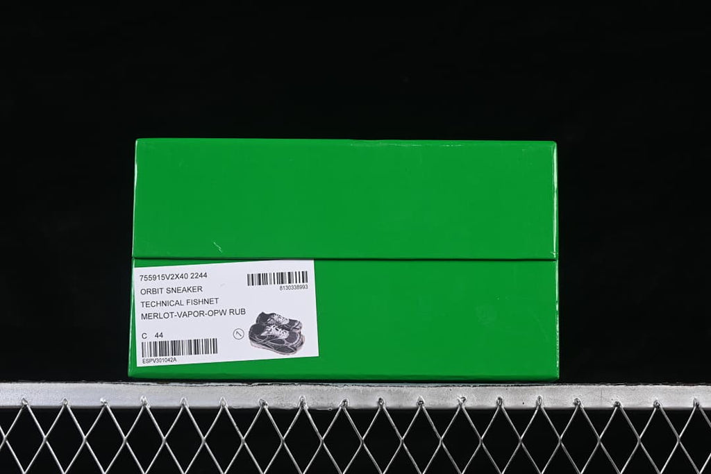 Green shoe box with a label identifying the Orbit sneaker and sample size C 44.