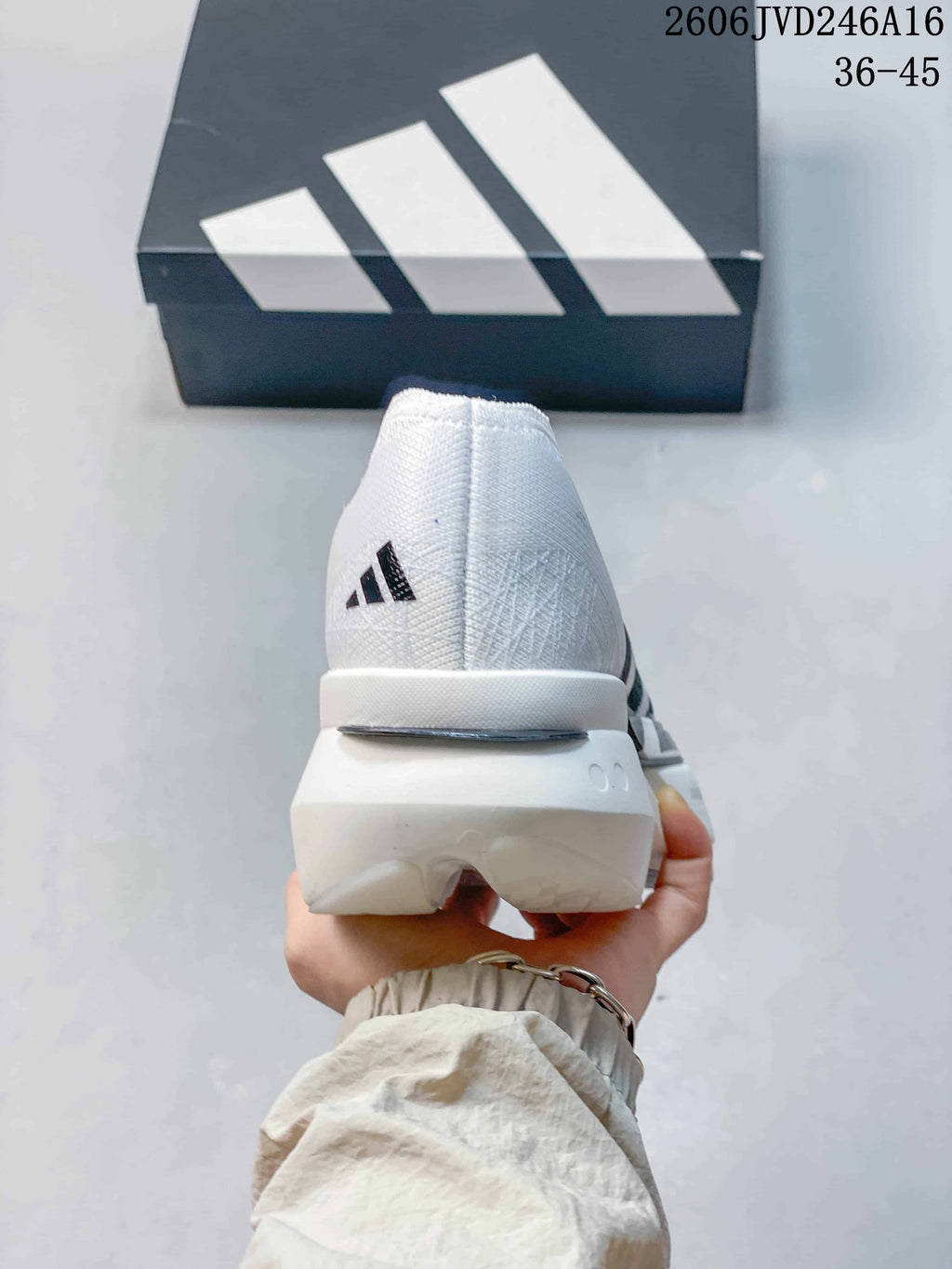 Rear view of the white running shoe with Adidas branding and a sculpted heel