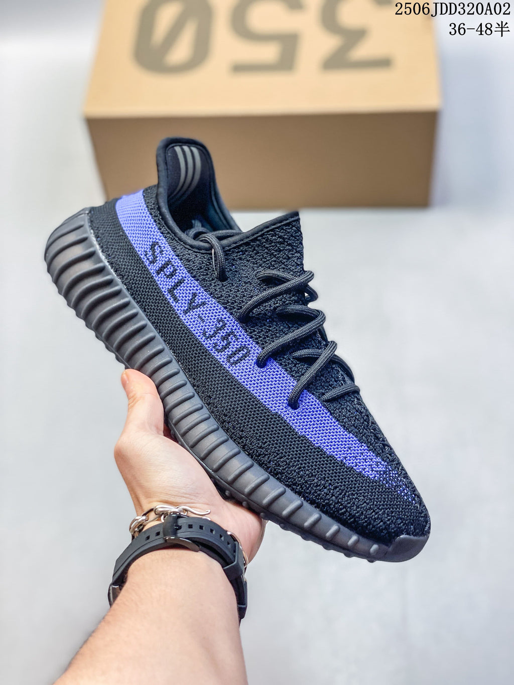 Black Adidas Yeezy-style sneaker with a blue side stripe and ribbed sole