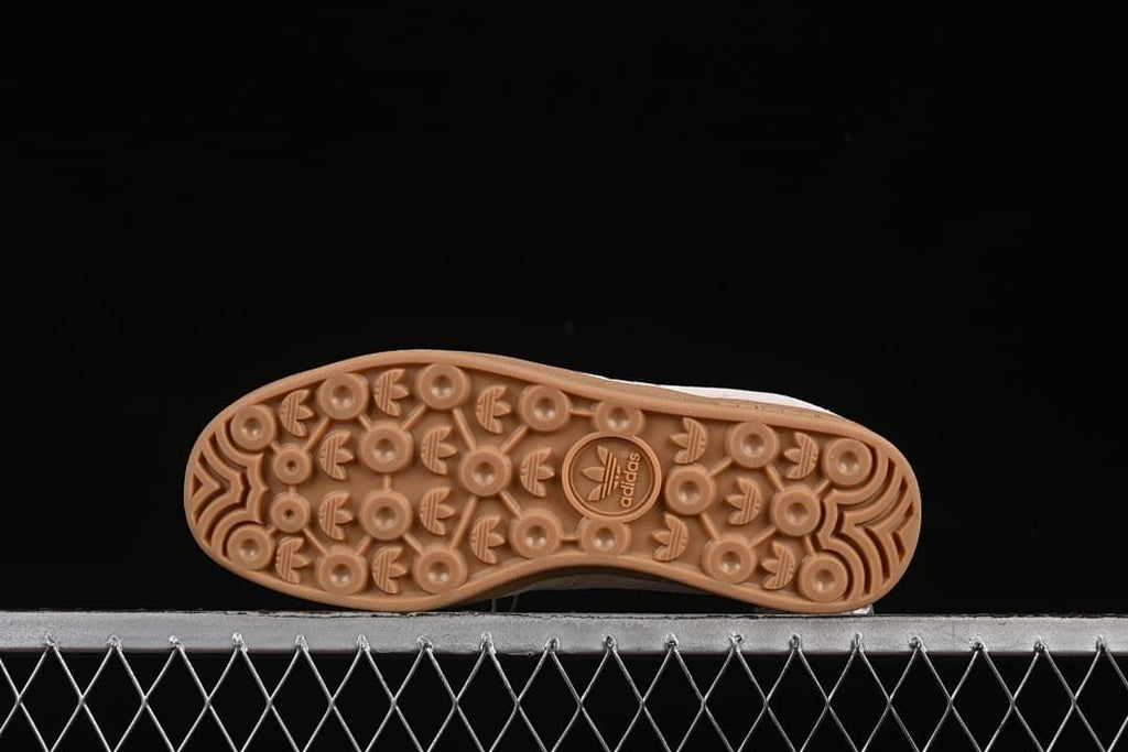 Underside view showing the patterned gum-colored outsole