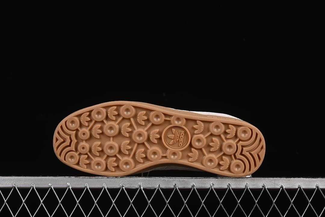 Underside view showing the patterned gum-colored outsole