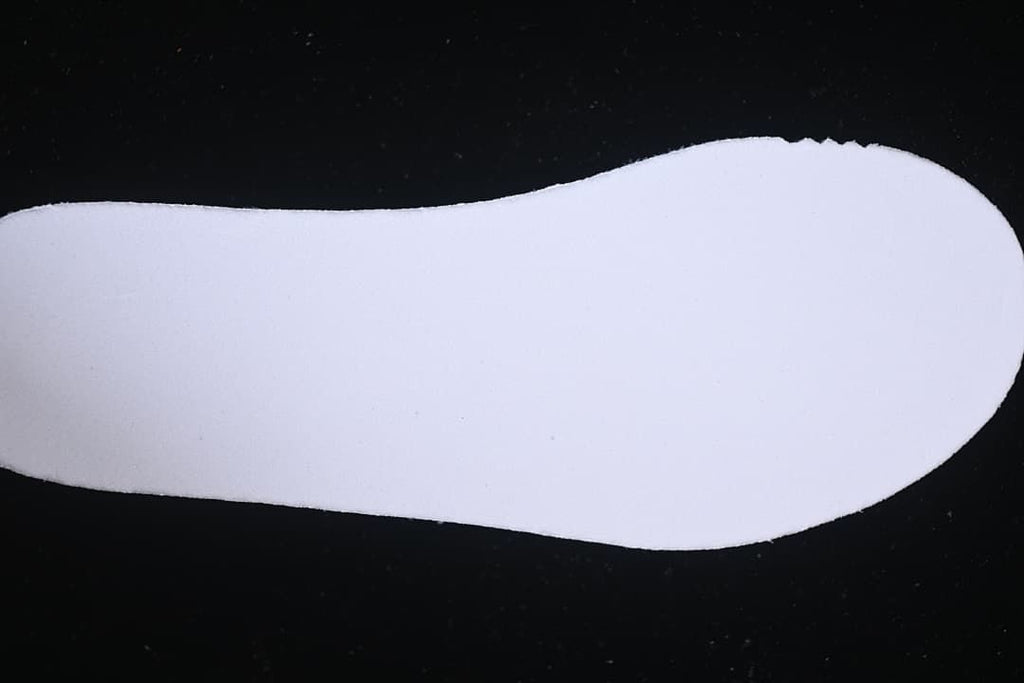 White shoe insole shown against a dark background.