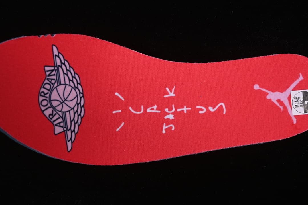 Red insole with Jordan branding and a visible men's-size label.