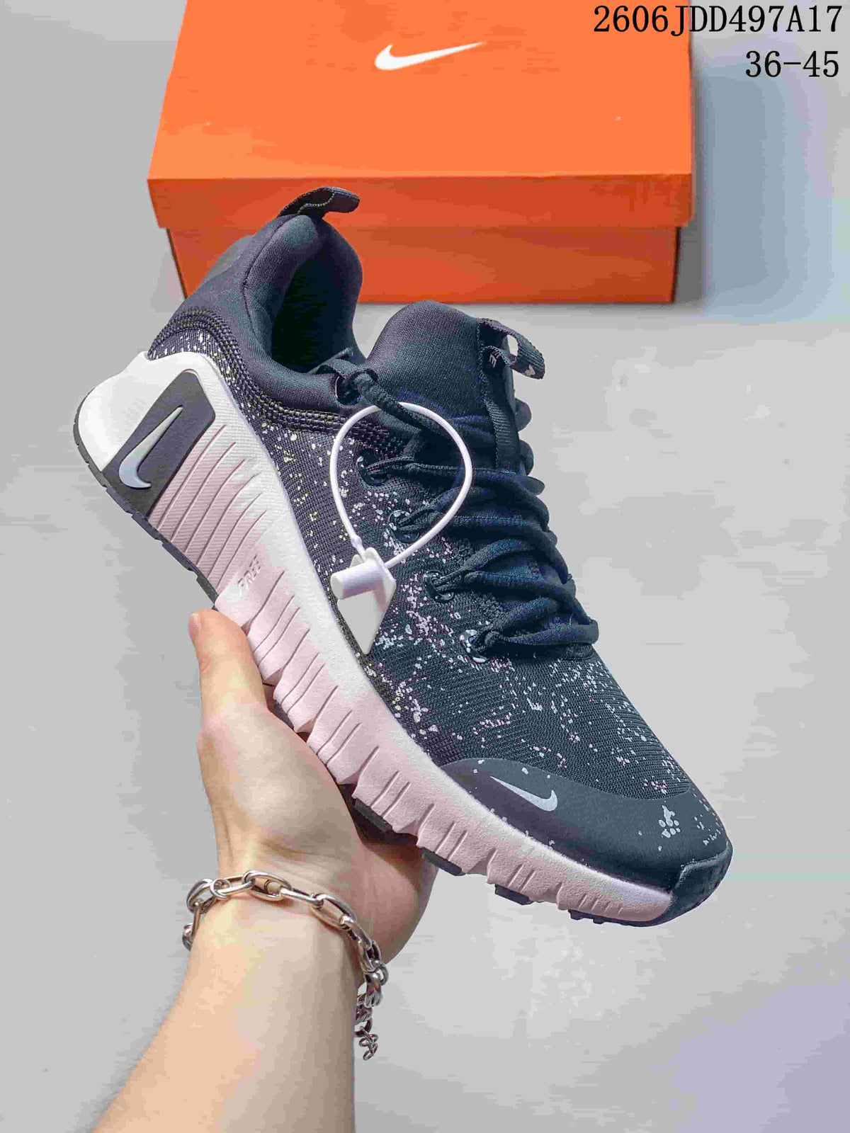 Angled side view of a Nike Free Metcon 7 shoe with dark speckled upper and pale midsole
