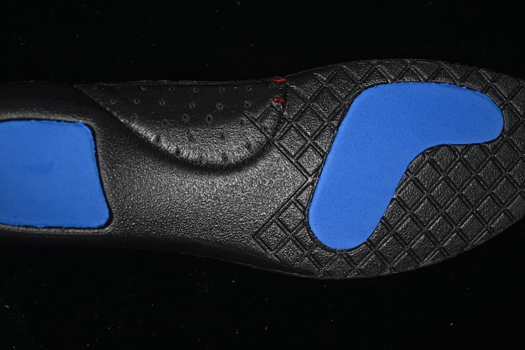 Close-up of the black outsole with blue sections