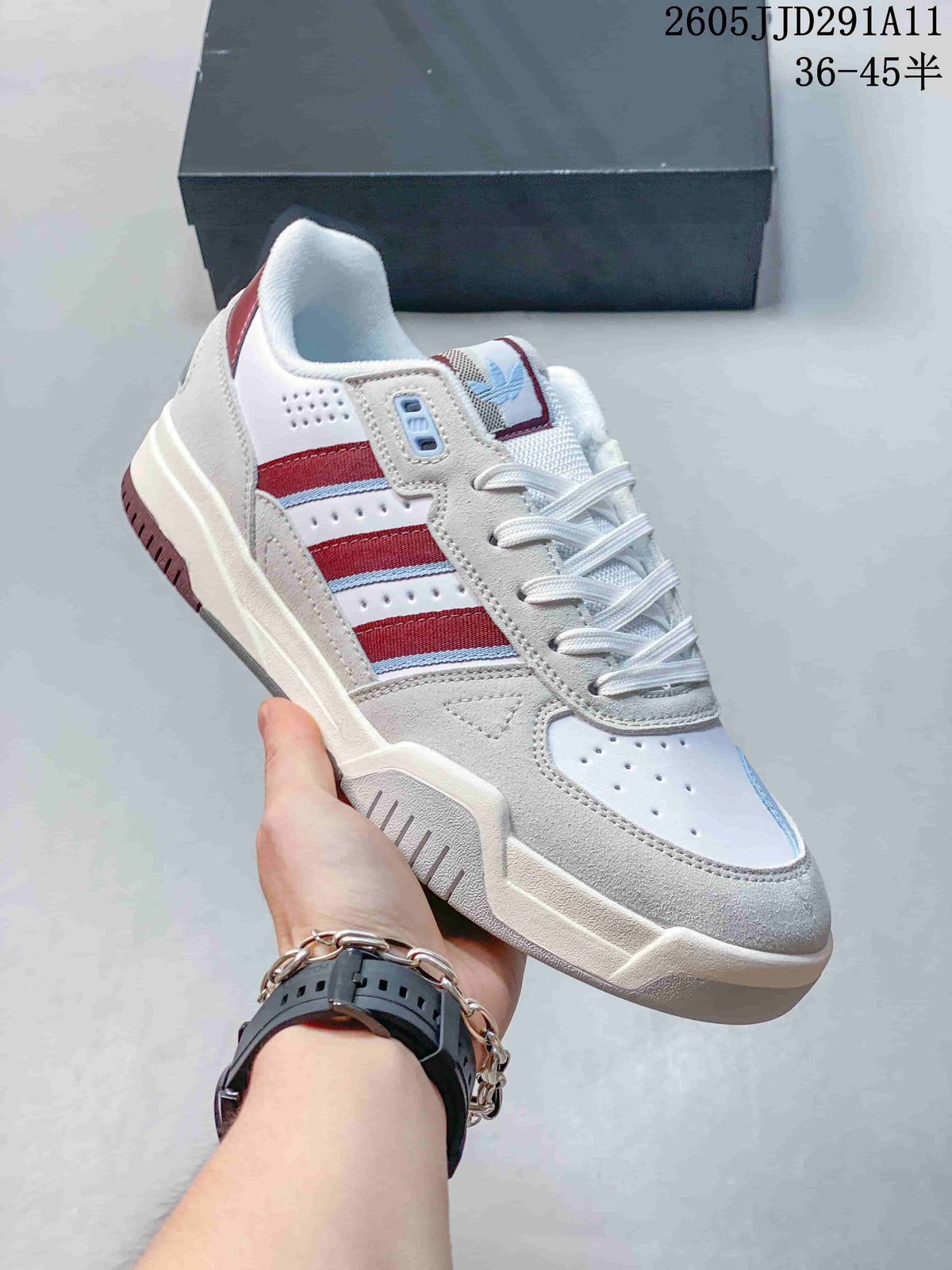 Close view of a Tekkira Cup sneaker with burgundy side stripes, light gray overlays, and gum-colored outsole