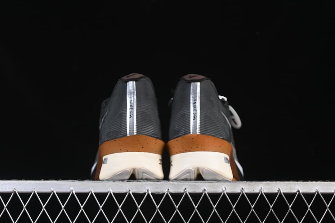 Rear view of both shoes showing heel strips and copper-toned accents.