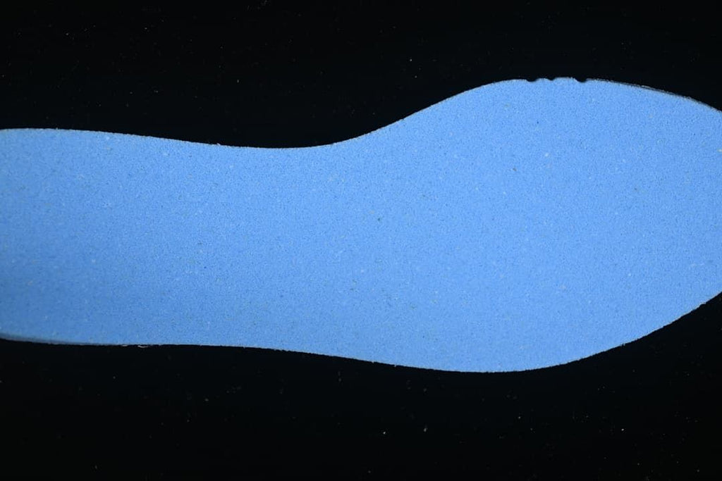 Blue insole shown separately against a dark background